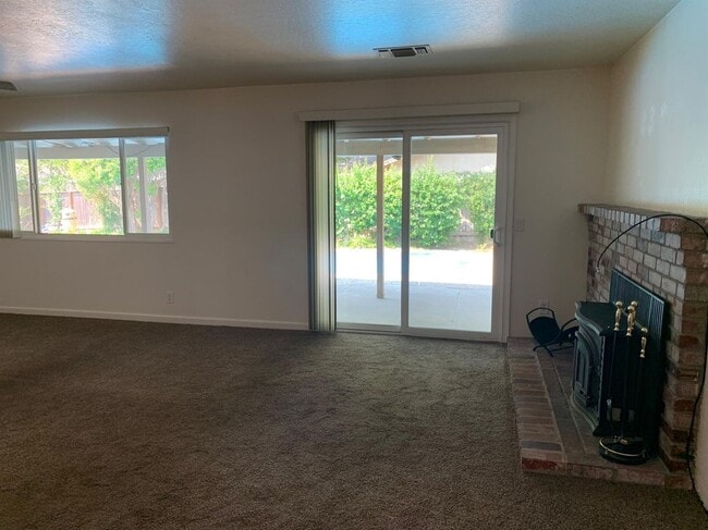 Building Photo - Enjoy the Backyard Pool at This 4-Bedroom ...