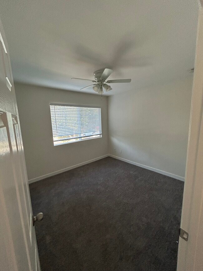 Third bedroom with carpeted floors - 11690 Kismet Ave