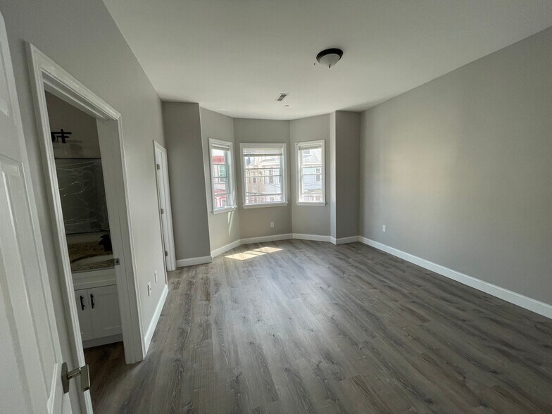 Unit two: master bedroom with double-sink master bathroom and walk-in closet to left. - 34 Falcon St