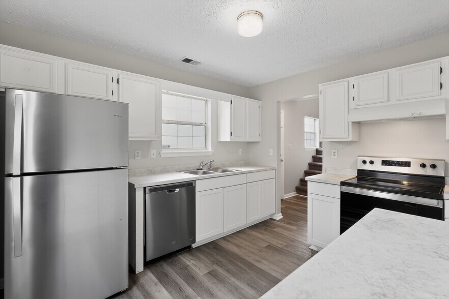 Stainless steel appliances with lots of cabinets and counterspace - 1029 Plantation Way NW