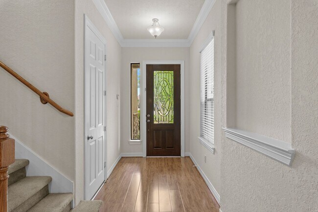 Building Photo - Luxury Townhome with Attached Garage & Outdoor Entertaining Area - $100 off first and second mont!