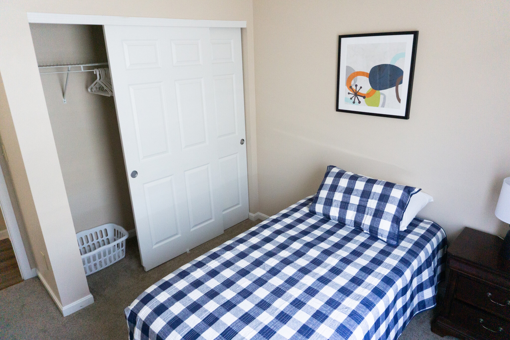 Bedroom three hasa twin bed, dark brown dresser and matching night stand. - 485 Colby Ct