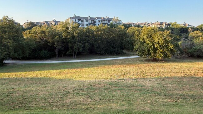 Building Photo - Updated 2 Bed/2 Bath North Austin Condo with Rare Greenbelt Views