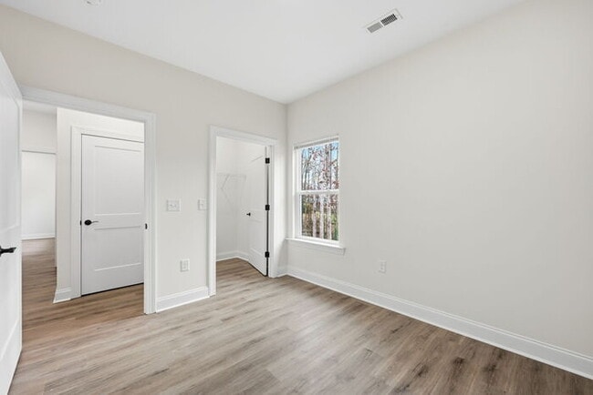 Building Photo - Stunning lakeside new construction: 4 bedroom and 3 bath home