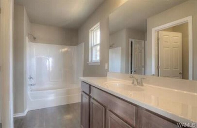 Building Photo - Stylish 4BR/2BA Home with Garage & Privacy...