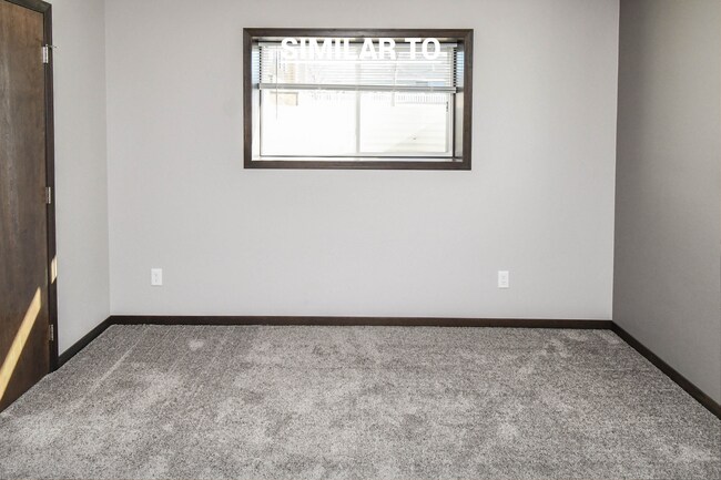 Building Photo - East Sioux Falls 4-Bedroom Townhome – Style, Space & Convenience!