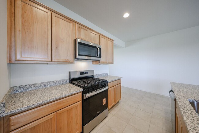 Building Photo - New 4 Bedroom + Den Home in Asante Community