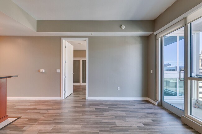 Building Photo - Iconic Strip-View Luxury | Elegant 1BR + Den High-Rise Residence