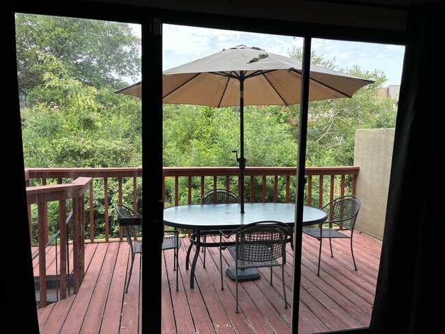Back deck with patio furniture - 3913 Whooping Crane Cir