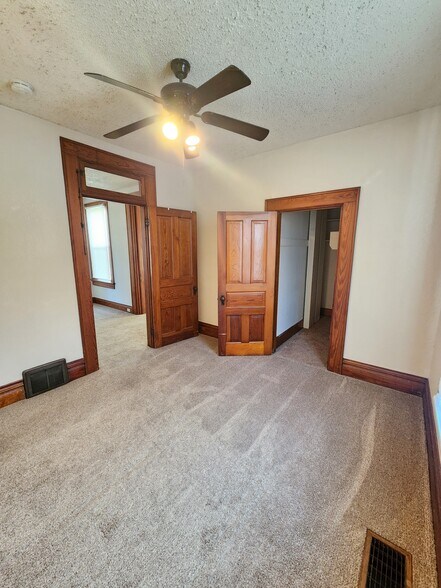 Bedroom 1: Large Windows & Ceiling Fan - 2548 Jackson St