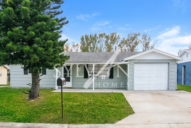 Primary Photo - The living is easy in this 3 bedroom, 2 ba...