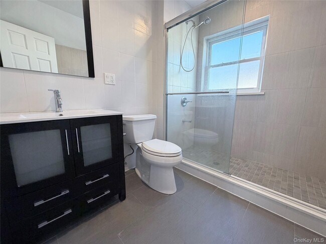 Building Photo - 210-10 56th Ave