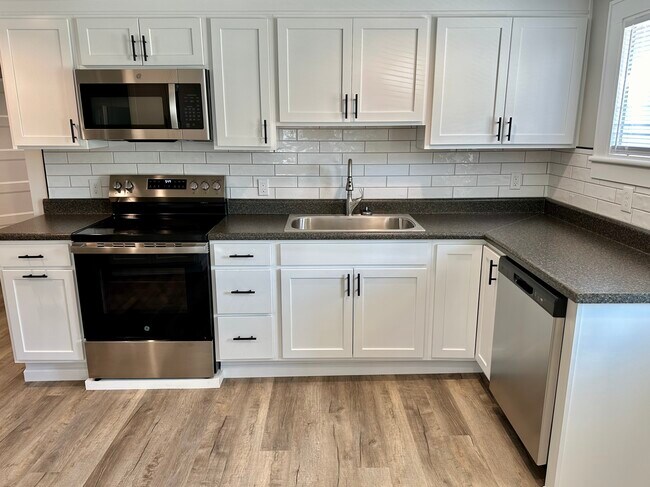 Well appointed kitchen with tiled backsplash - 2304 Belle Ave NE