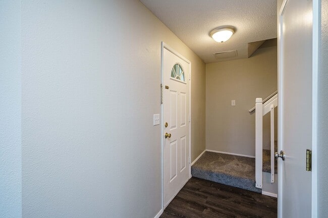 Building Photo - Recently Updated with Wood Laminate Flooring and Fresh Paint