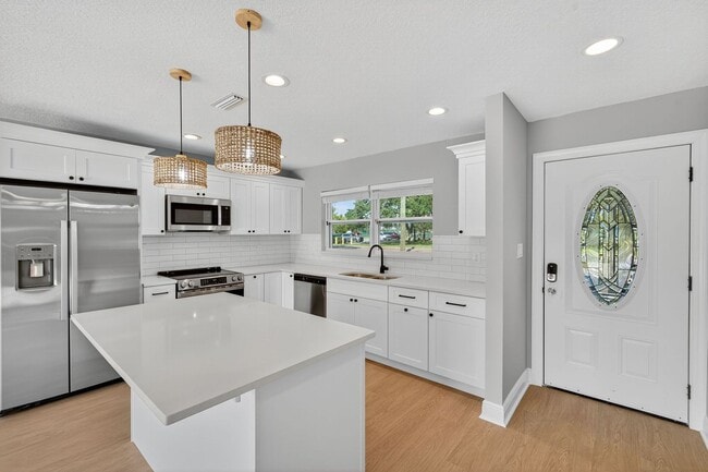 Building Photo - Fully Remodeled 3BR Home with Large Fenced Yard & New Deck