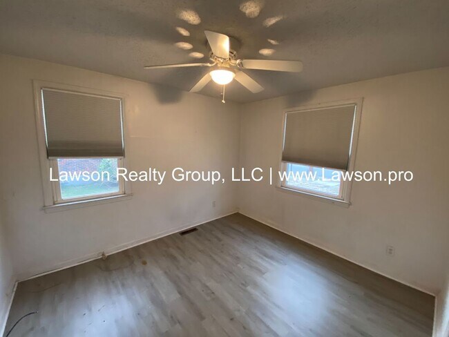 Building Photo - Well Maintained Three Bedroom with Fenced Yard and Shed