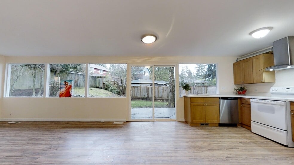 Living room &amp; kitchen looking out to the front yard - 12405 NE 109th Pl