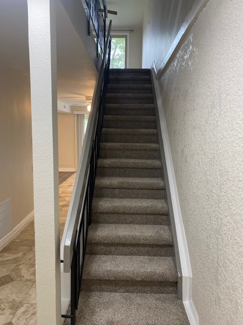 Stairs from lower level to main floor - 411 E Highline Cir
