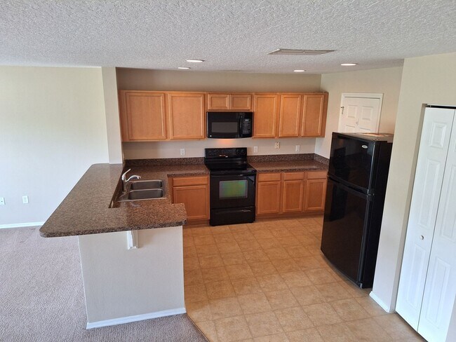 Building Photo - 2BR 2.5BA LANDINGS AT SUGAR MILL TOWNHOME