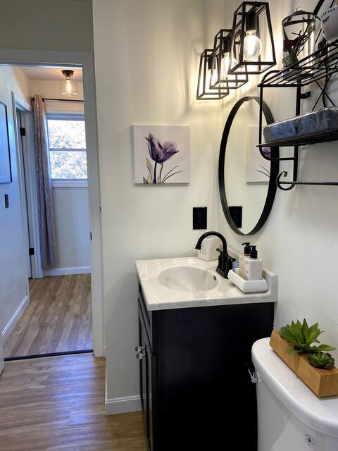 Updated bathroom vanity with modern fixtures and additional storage space. - 13 Brandywine Dr