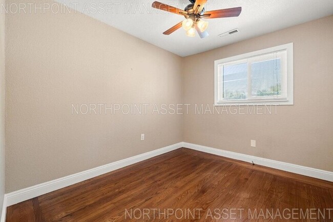 Building Photo - Welcome to this stunning 4-bedroom, 2-bath...