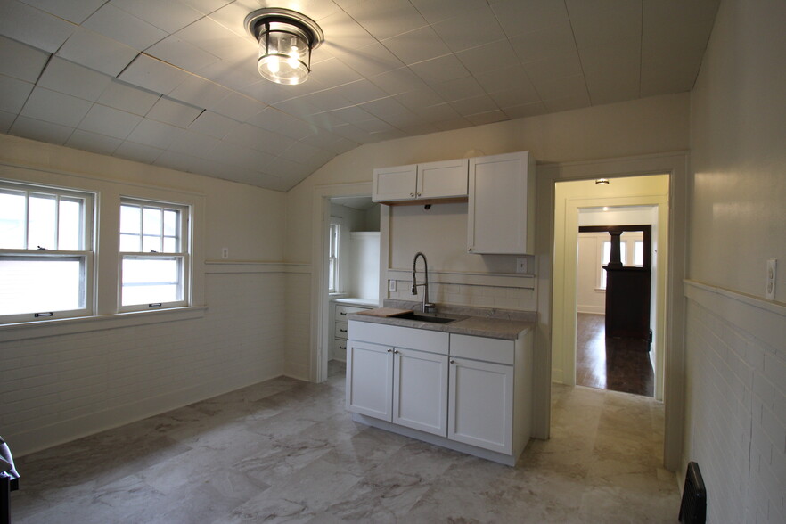 Kitchen features professional style sink, garbage disposal, and large walk in pantry - 1932 S 83rd St