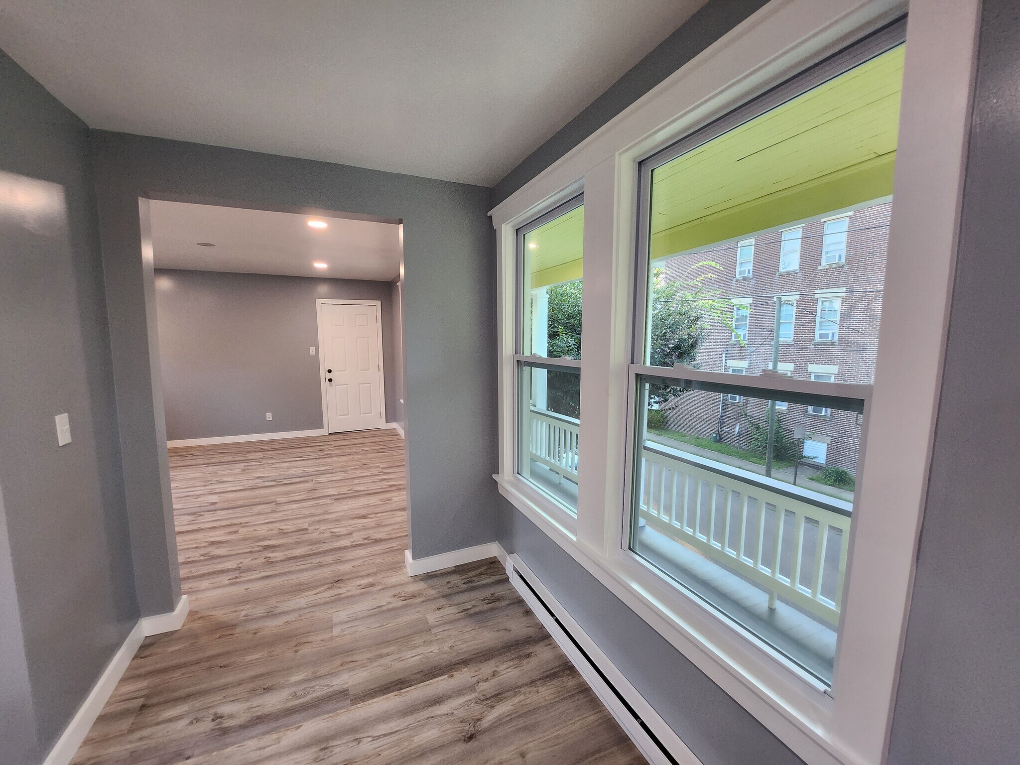 View of the Livingroom and Porch from the dining area. - 301 Broad St