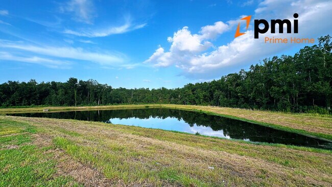 Building Photo - Brand New 5-Bedroom Home with Serene Water...