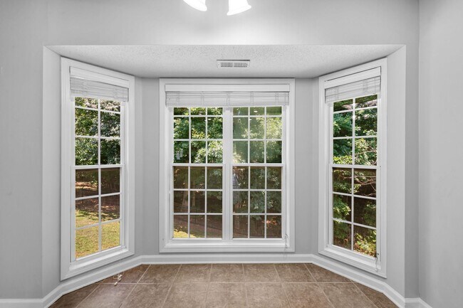 Building Photo - Stunning Stone Fireplace • Finished Basement • Fenced Yard