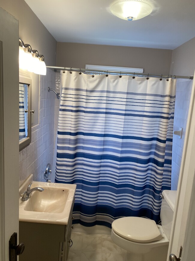 main floor bathroom with shower and tub - 4507 Walnut St