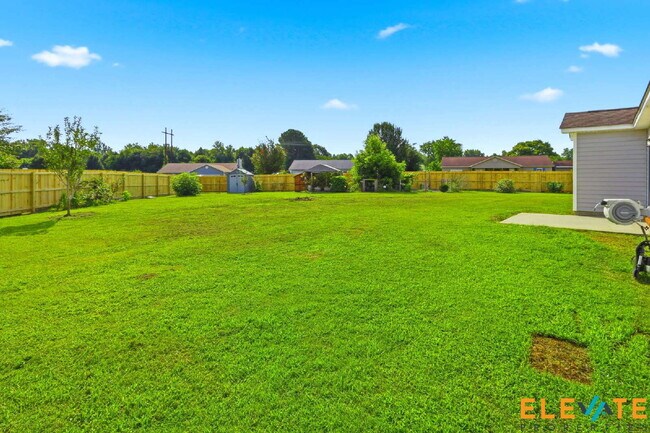 Building Photo - Beautiful Like-New 3 Bedroom Home with Huge Fenced Yard, Greenhouse & Storage