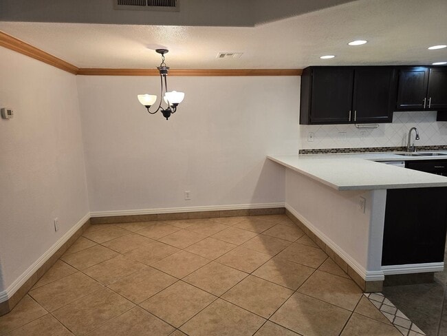 Building Photo - UPGRADED CONDO READY TO MOVE INTO!