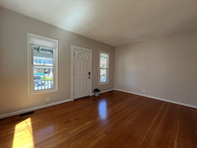 Building Photo - Charming Cottage with Hardwood Flooring, Modern Kitchen & Beautiful Outdoor Living Areas