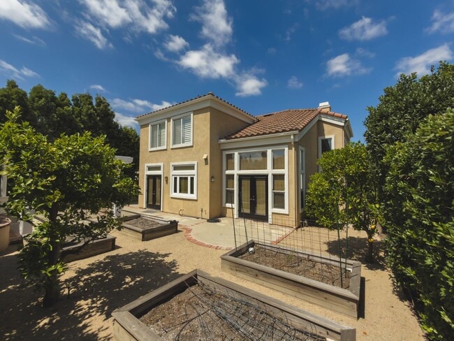 Building Photo - Elegant Mediterranean Living with Private Pergola Garden & Resort Amenities