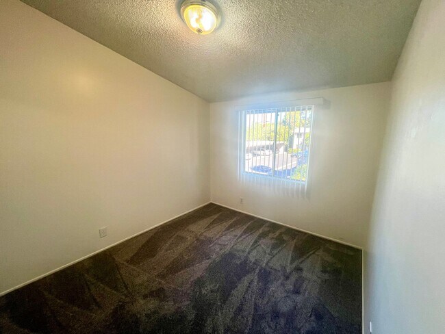 Building Photo - Spacious Two Bedroom with New Carpet - Available Now!