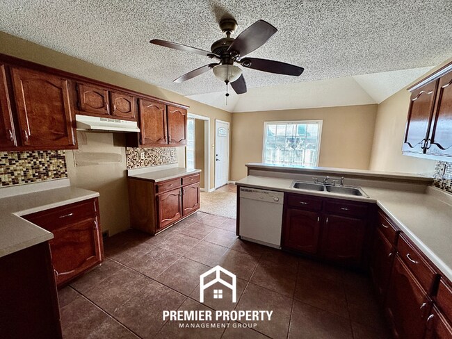 Building Photo - Spacious 3BR/2BA Near Southwind | 1,958 Sq Ft, Brick Fireplace, 2-Car Garage & Quiet Cove