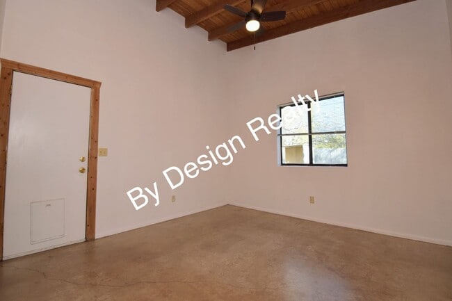 Building Photo - Charming Mid-Century Style: Vaulted Beams & Private Oversized Yard