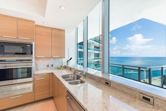 Building Photo - 10295 Collins Ave