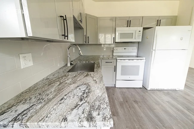 Building Photo - Beautifully Renovated, Spacious 4BR Home w/ Basement & Backyard!