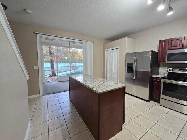 Building Photo - Great Town Home in Gated Community with Pool and Pond View