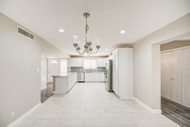 Building Photo - Beautifully remodeled corner 4/2 with pool...
