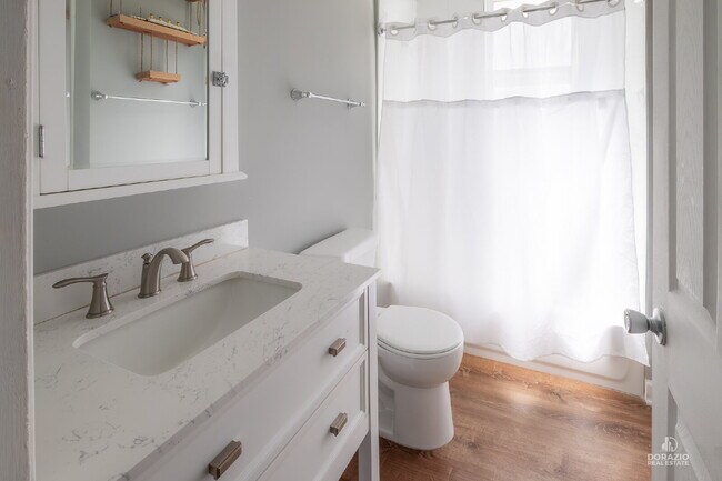 Building Photo - Modern 4BR Apartment with Hardwood Floors, Balcony & Central A/C