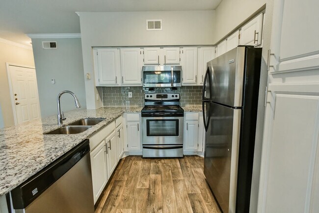 Building Photo - Your Next-Level Home Awaits – Specials Ava...