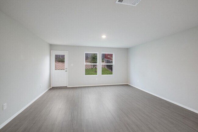 Building Photo - Open-Concept Living with New Flooring