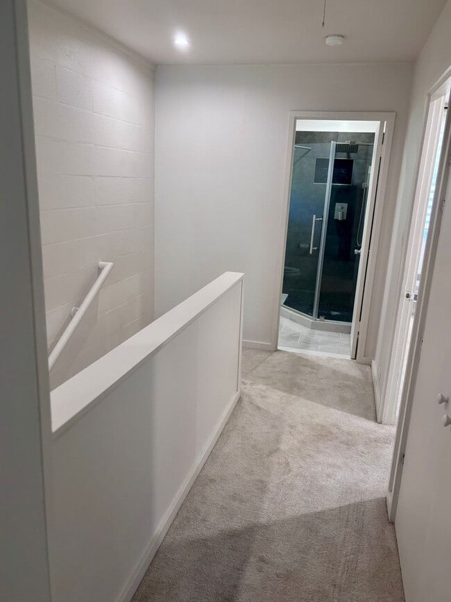 Building Photo - Available Now | 2 Bedroom, 2 Bathroom Townhouse with 1 Assigned Parking Stall at Tropic Gardens 1