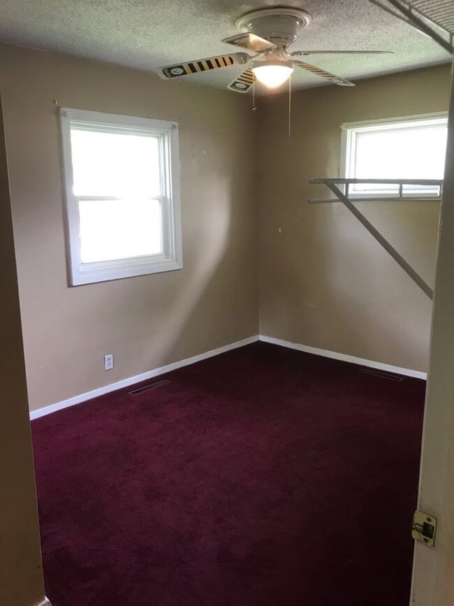 Building Photo - Nice, 4BR rancher with appliances, attached garage and fenced back yard.