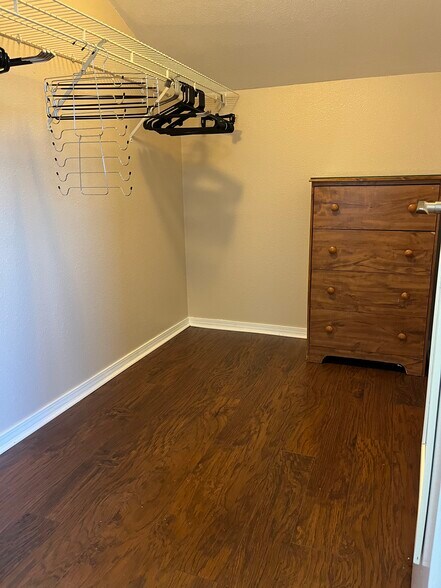 very large walk in closet with hangers and dresser - 4569 E Alamos Ave