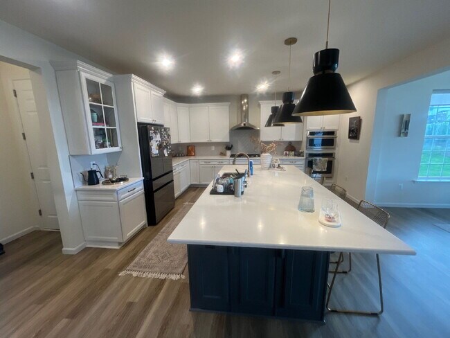 Building Photo - Stunning 5-Bedroom Custom Home with Solar, EV Charging & Private Media Room