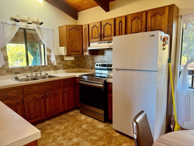Building Photo - Experience comfort in this charming 3 bed, 2 bath rental home with a wood-burning stove, sunken j...