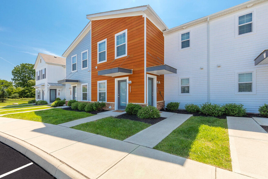 Experience modern elegance with this colorful townhouse exterior. - The Gramercy New Albany